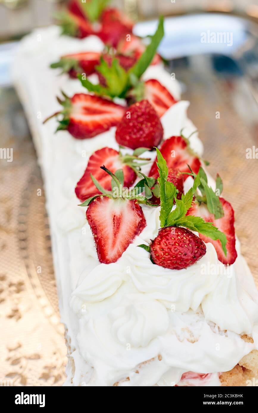Freshly baked sweet strawberry LongCake Roll, also called Strawberry