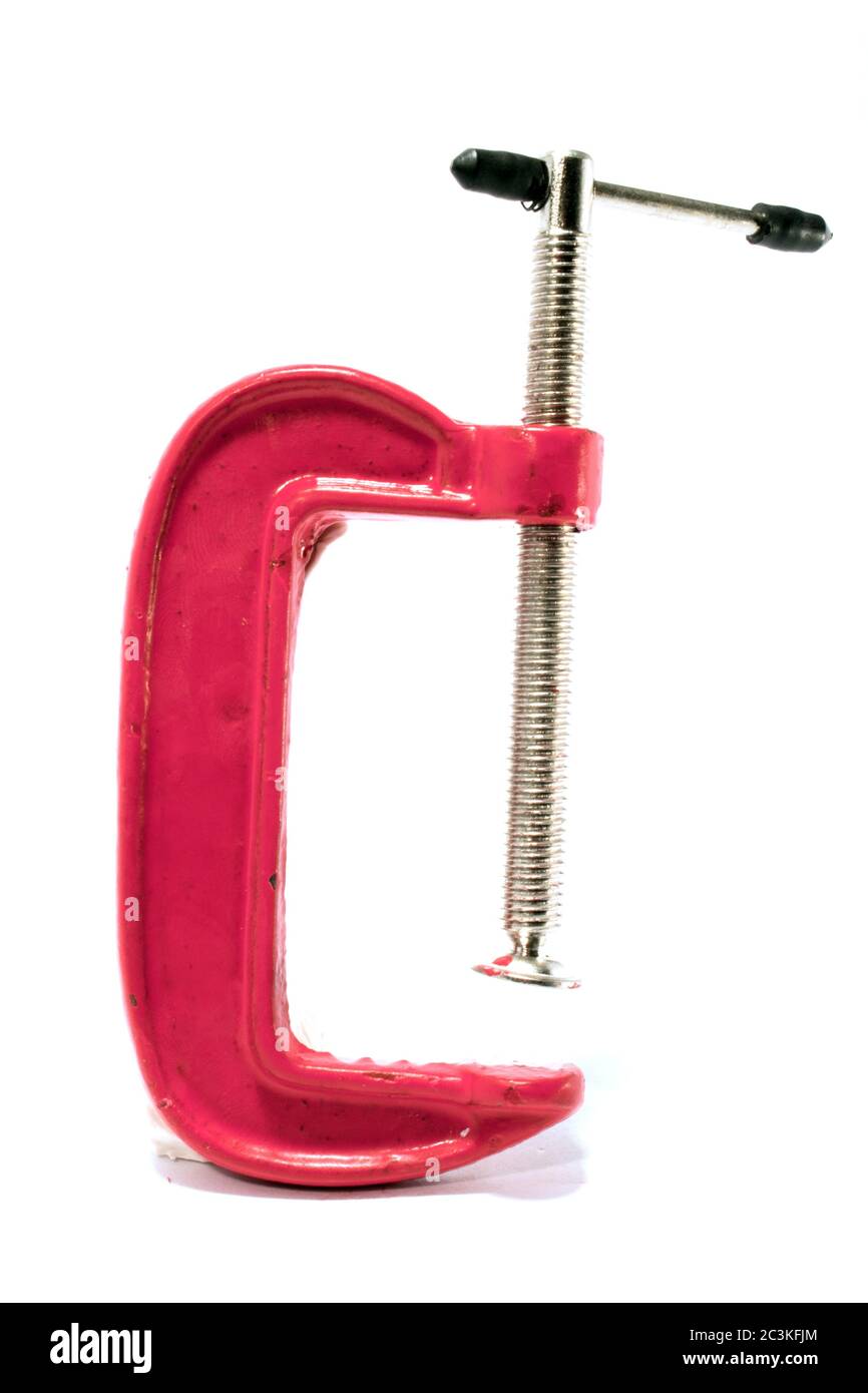 Vertical shot of a red c-clamp isolated on the white background Stock Photo