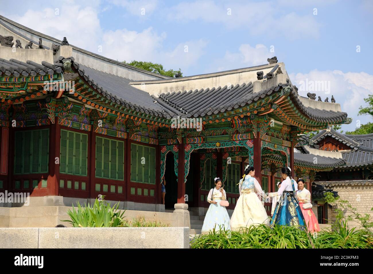 Seoul South Korea - Gyeongbokgung Palace group of vistors wearing traditional costumes Stock Photo
