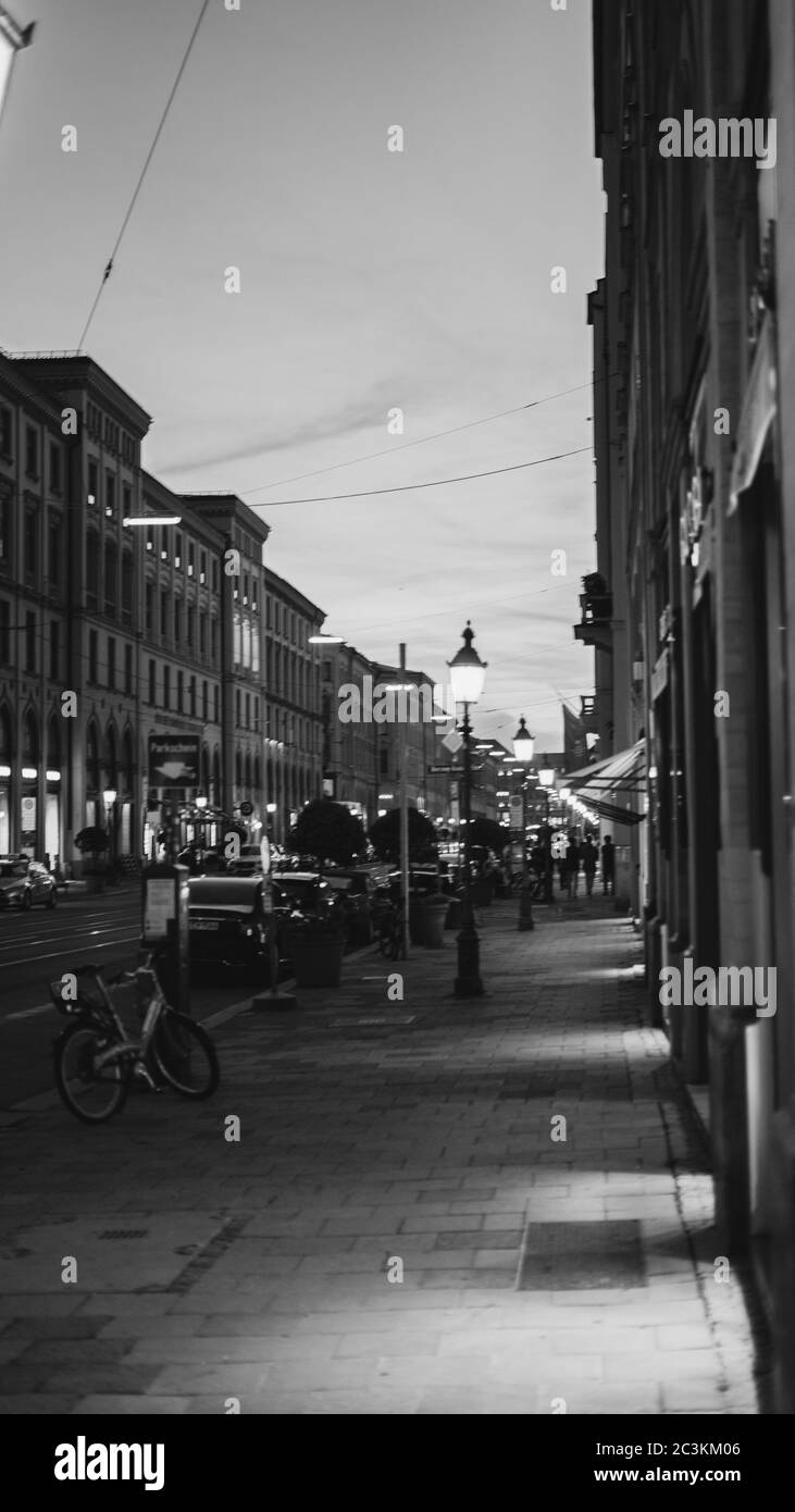 Vertical grayscale picture of a city with lights Stock Photo - Alamy