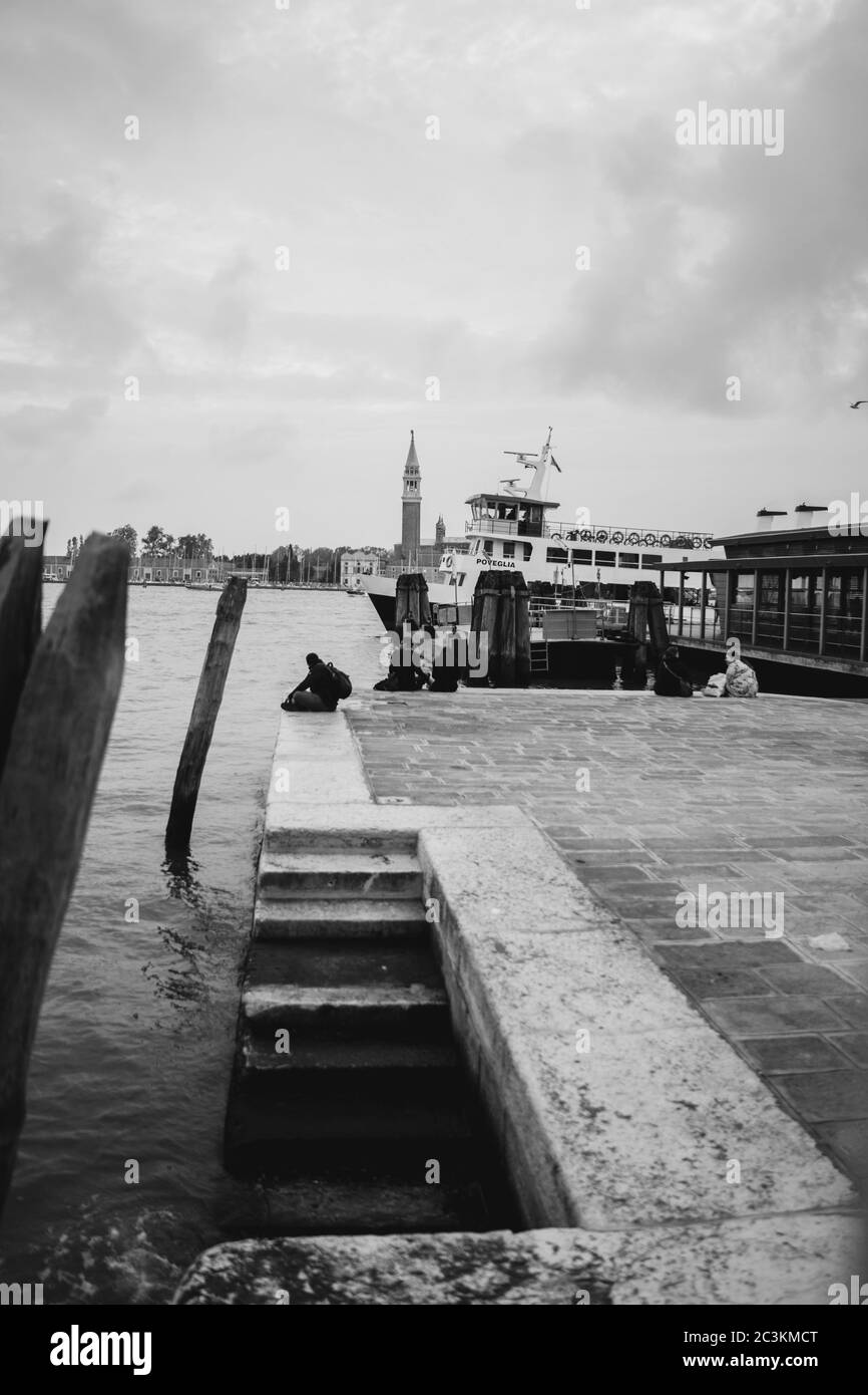 Vertical grayscale picture of boats in a port Stock Photo - Alamy