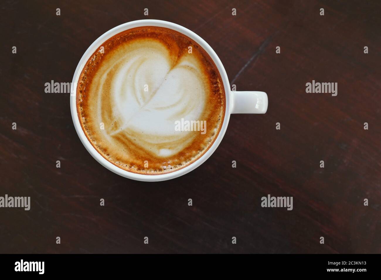 hot coffee cappuccino or latte coffee top view woodwn table with clipping path on cup of coffee Stock Photo