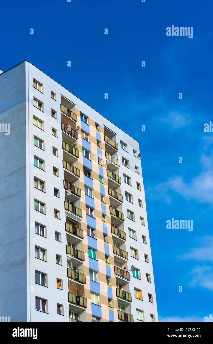 Vertical shot of a tall modern architectural building with a blue sky ...