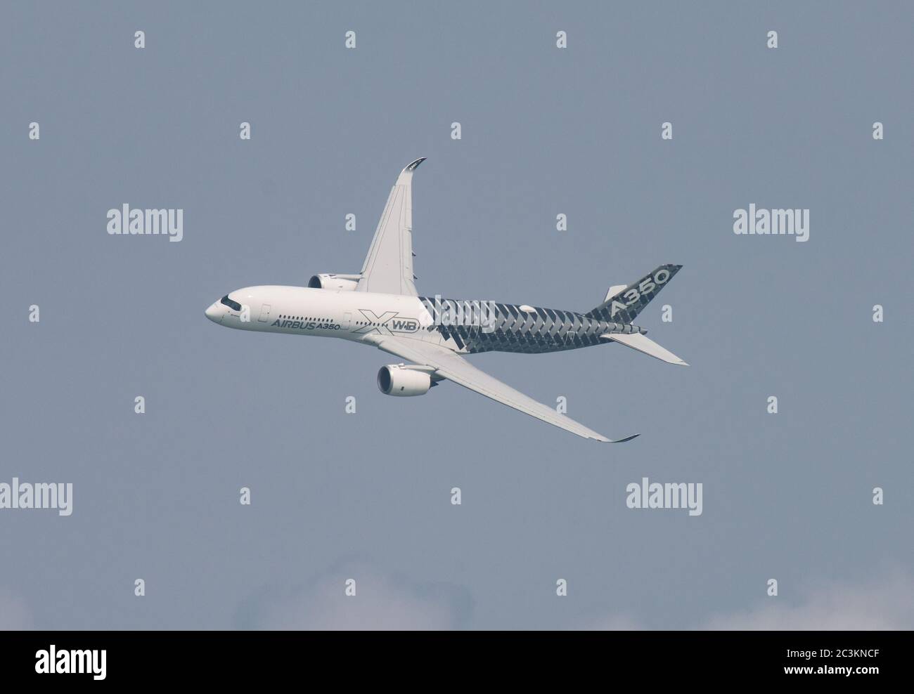 Singapore - February 14, 2016: Airbus A350 XWB during it’s performance at Singapore Airshow at Changi Exhibition Centre in Singapore. Stock Photo