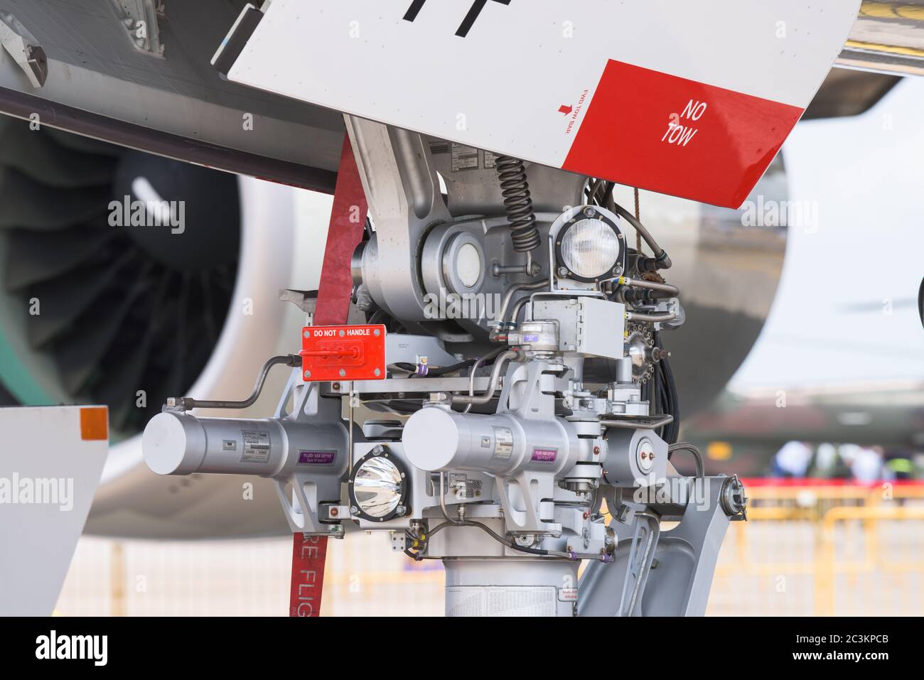 Singapore - February 16, 2016: Detail of the nose landing gear of an Airbus A380 at Singapore Airshow at Changi Exhibition Centre in Singapore. Stock Photo