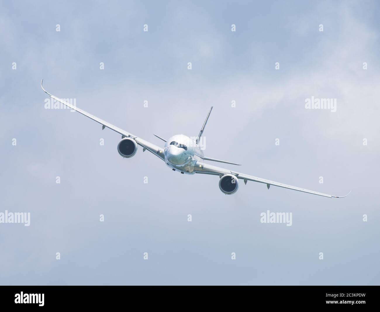 Singapore - February 14, 2016: Front view of Airbus A350 XWB during it’s performance at Singapore Airshow at Changi Exhibition Centre in Singapore. Stock Photo