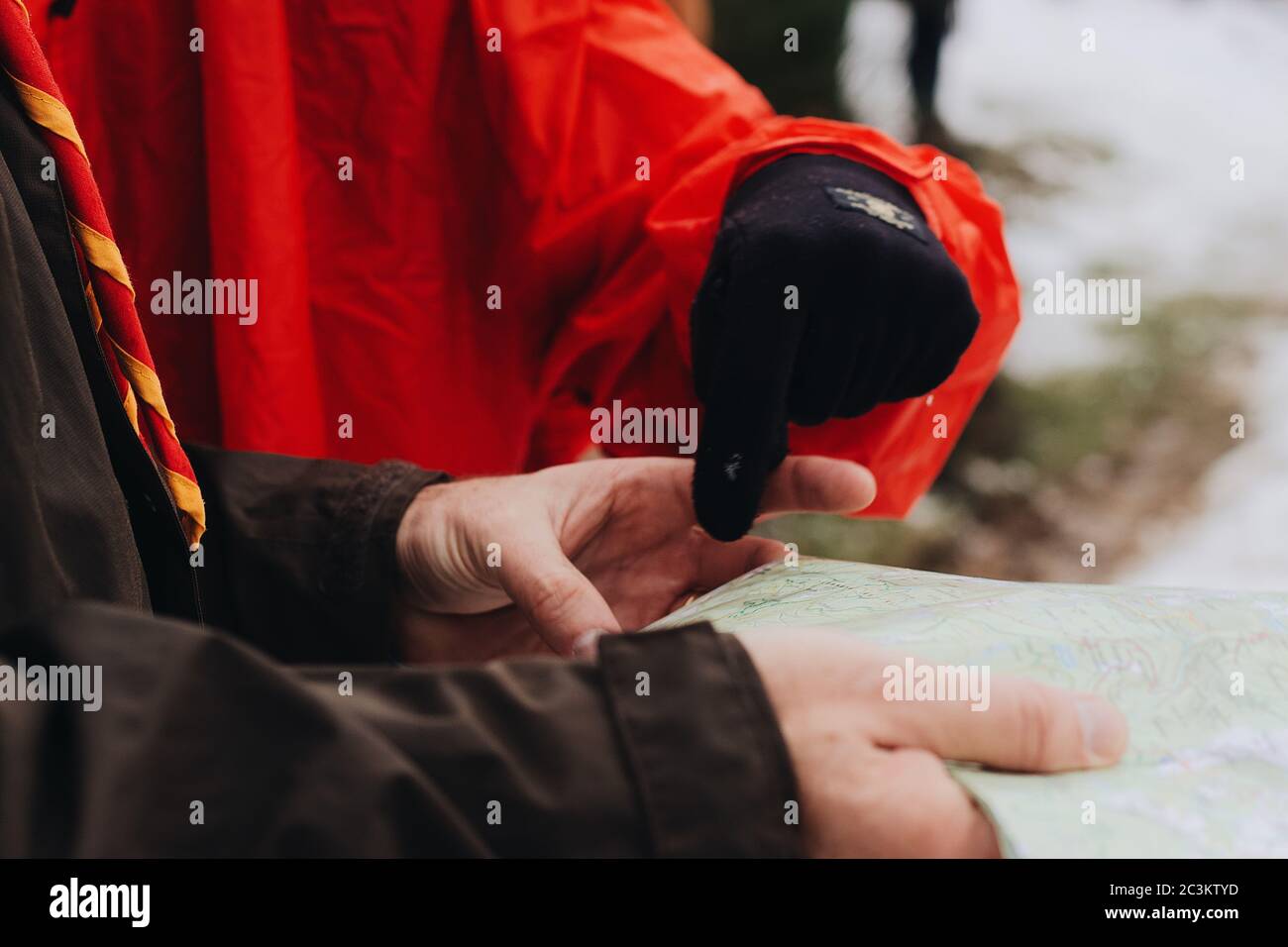 Person's hand pointing a location on a map Stock Photo - Alamy