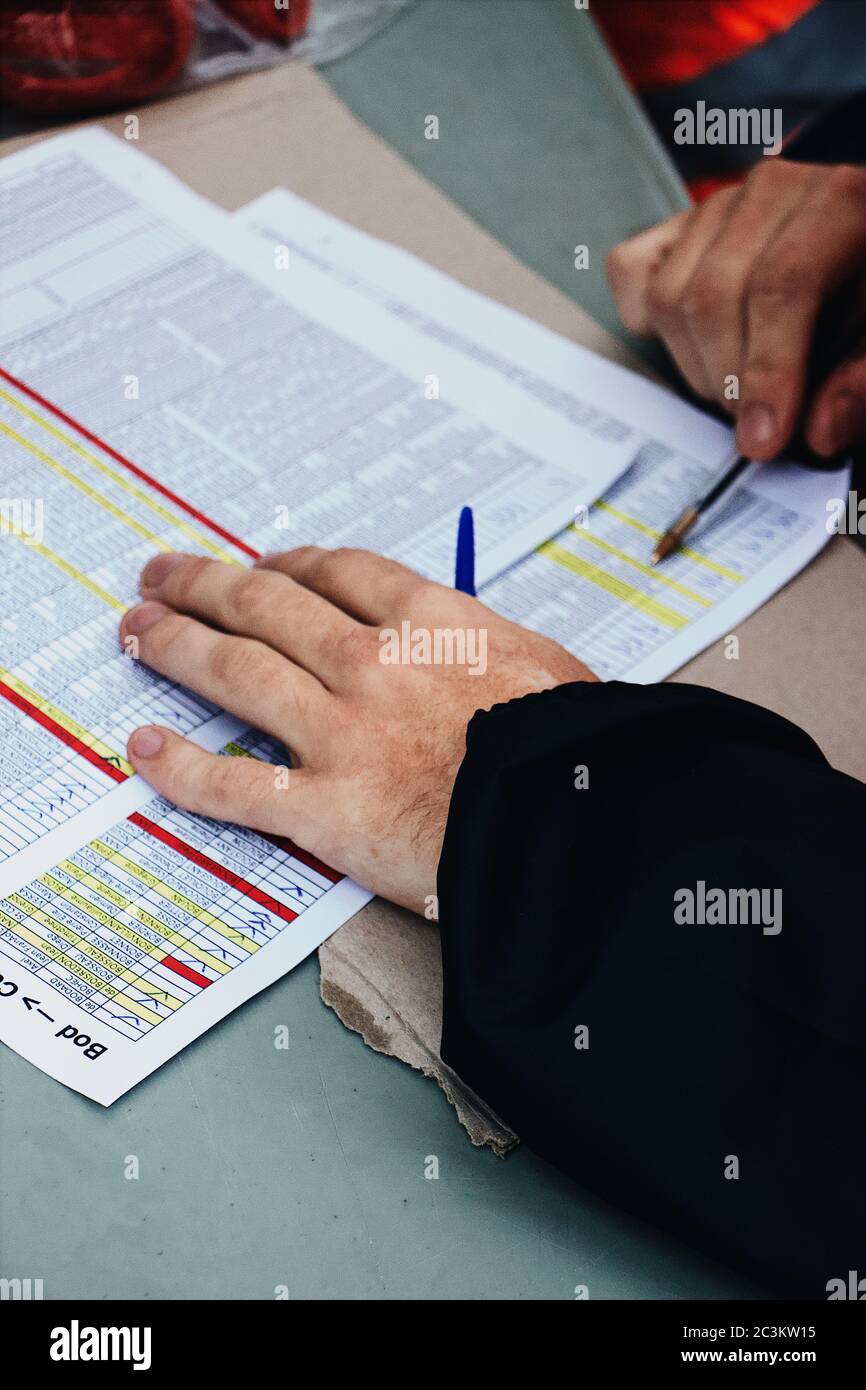 Hands of a man while working on the important documents Stock Photo