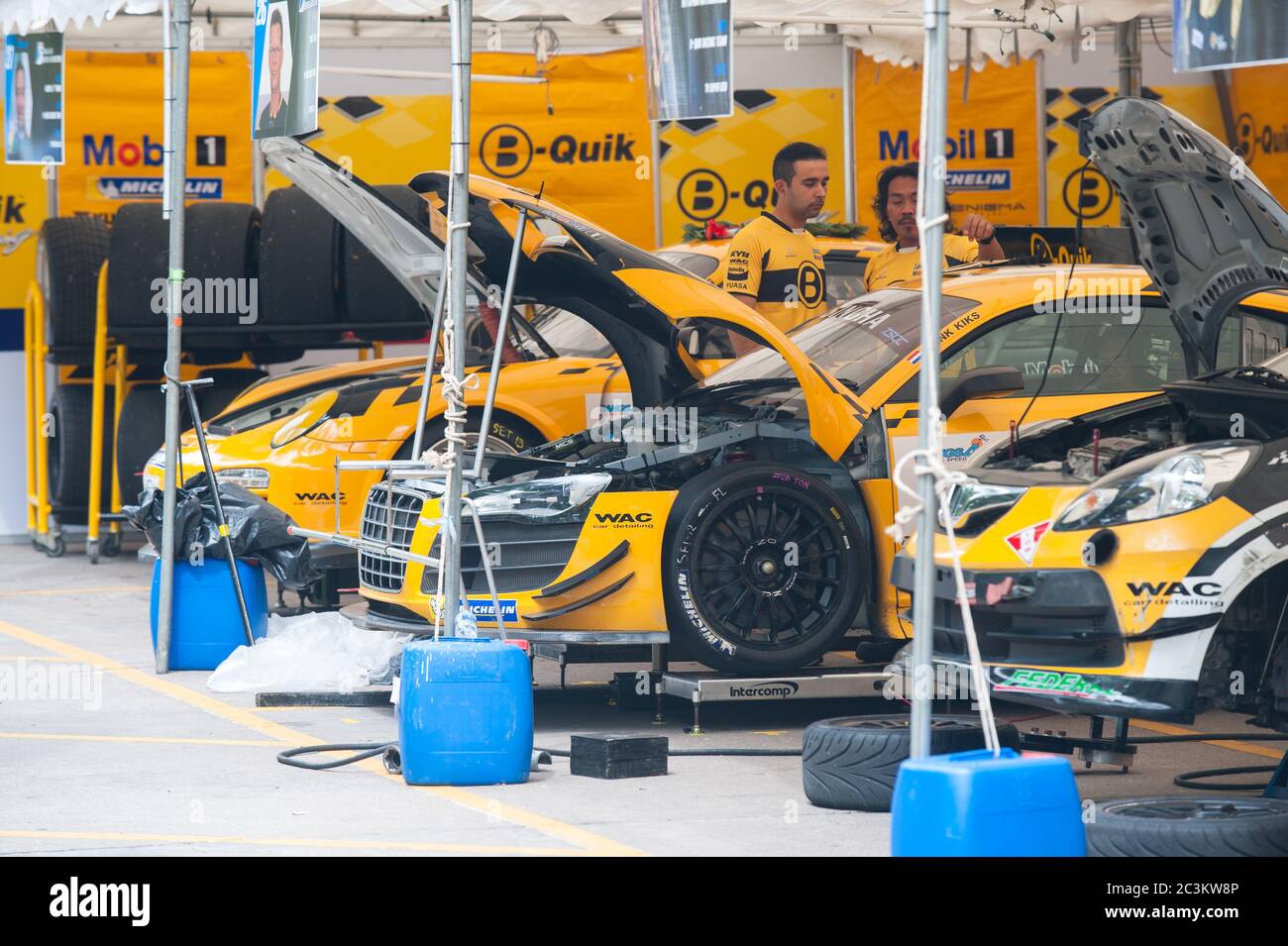 Bang Saen, Thailand - November 28, 2015: The cars of the B-Quik Racing Team, an Audi R8 and a Porsche 997 GT3 Cup, being prepared for Bang Saen Speed Stock Photo
