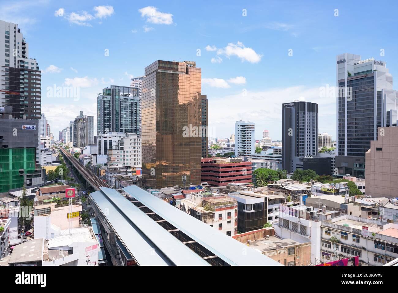 Bangkok, Thailand - May 22, 2015: With the BTS Skytrain, opened in 1999, Bangkok has developed fast in areas near the train stations, like here at Phr Stock Photo