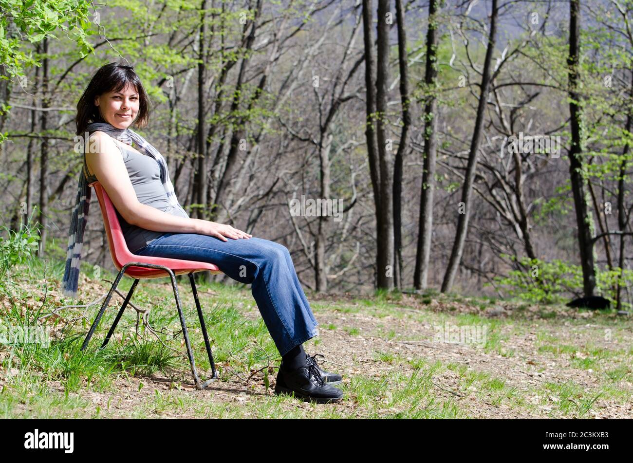 Girl relaxing on a garden chair hi-res stock photography and images - Alamy