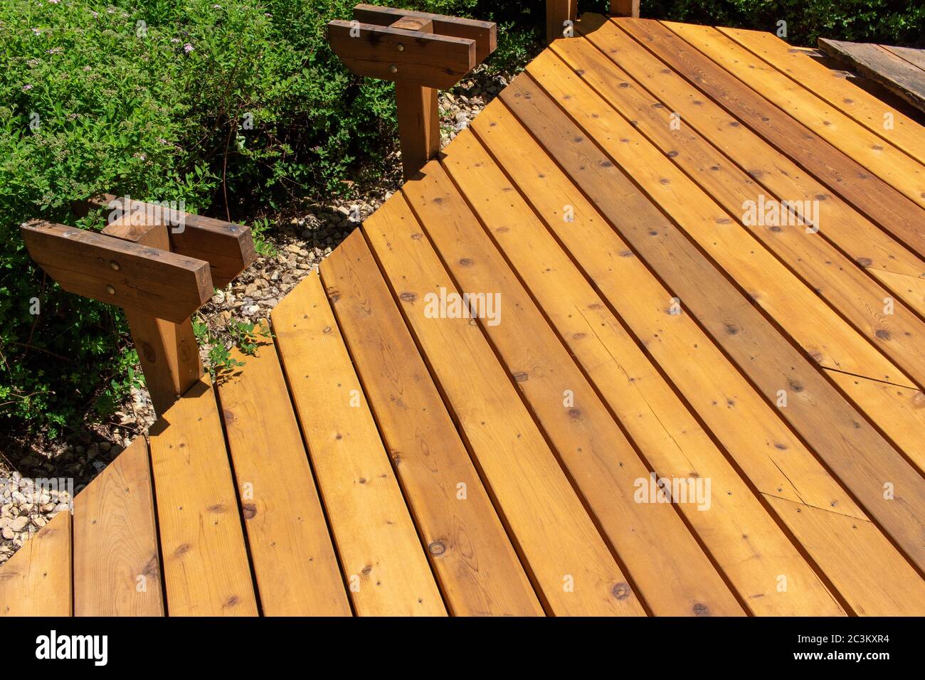 View of a cedar wood deck restoration with new floor boards Stock Photo