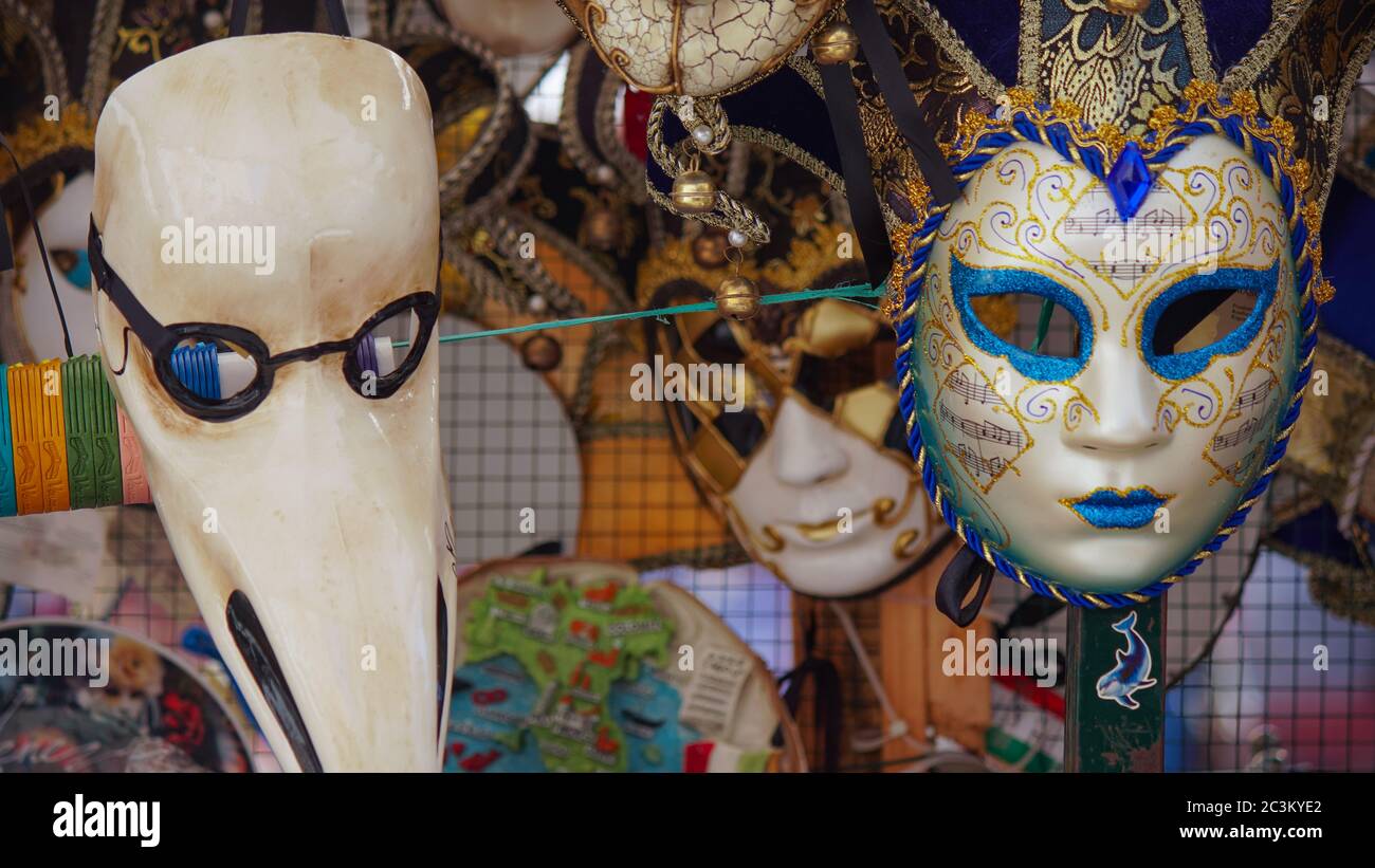 Colorful carnival masks on the market in Venice, Italy. Masks were worn in Venice to disguise the wearer from illicit activities:gambling, dancing, af Stock Photo