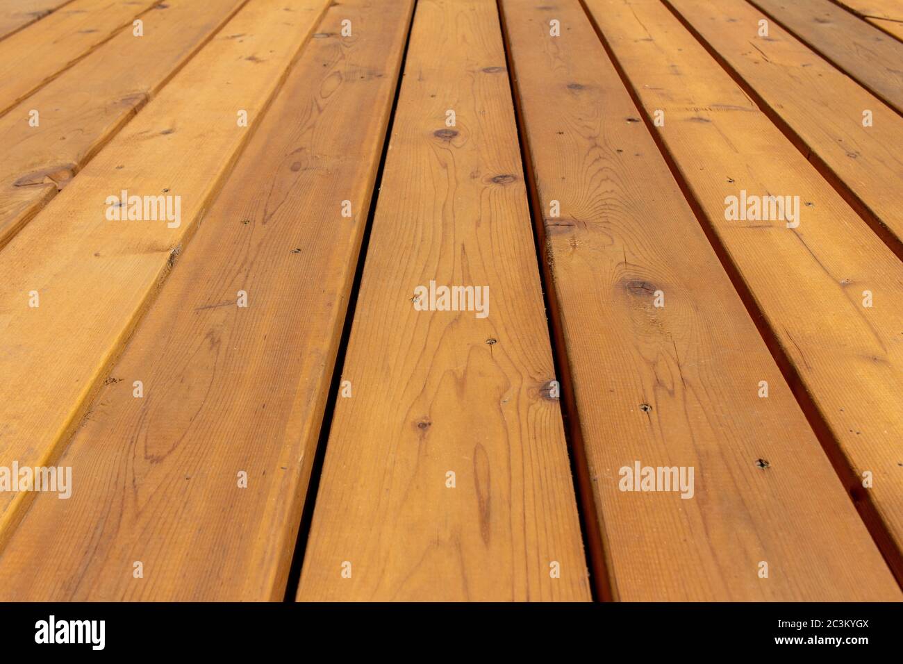 Close up texture background view of golden brown cedar wood deck