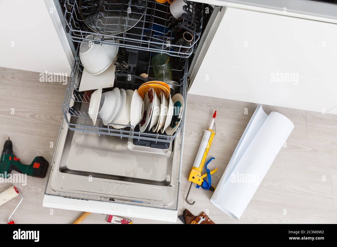 Home Dishwasher appliance being repaired in a kitchen Stock Photo Alamy