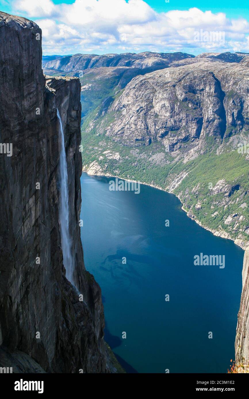 Aerial view of Lysefjorden from Kjeragbolten, with waterfall on the cliff and mountains in background, on the mountain Kjerag in Forsand municipality Stock Photo