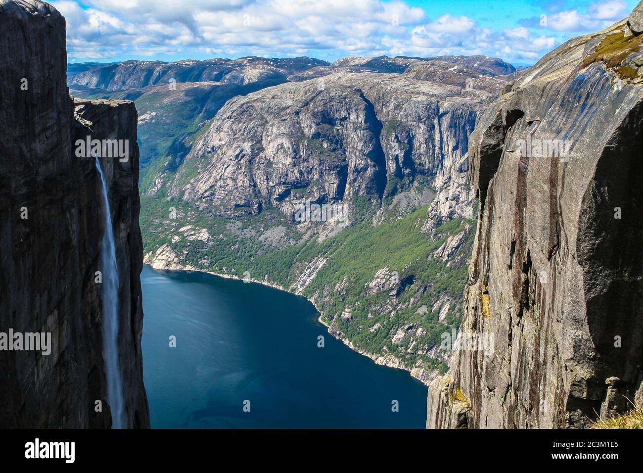 Aerial view of Lysefjorden from Kjeragbolten, with waterfall on the cliff and mountains in background, on the mountain Kjerag in Forsand municipality Stock Photo
