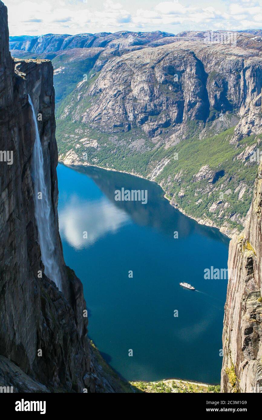 Aerial view of Lysefjorden from Kjeragbolten, with waterfall on the cliff and mountains in background, on the mountain Kjerag in Forsand municipality Stock Photo