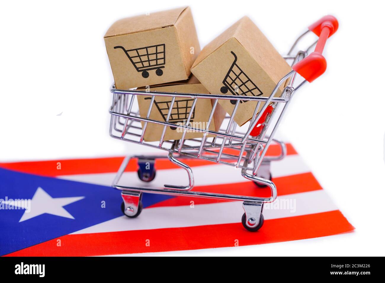 Box with shopping cart logo and Puerto Rico flag Import Export