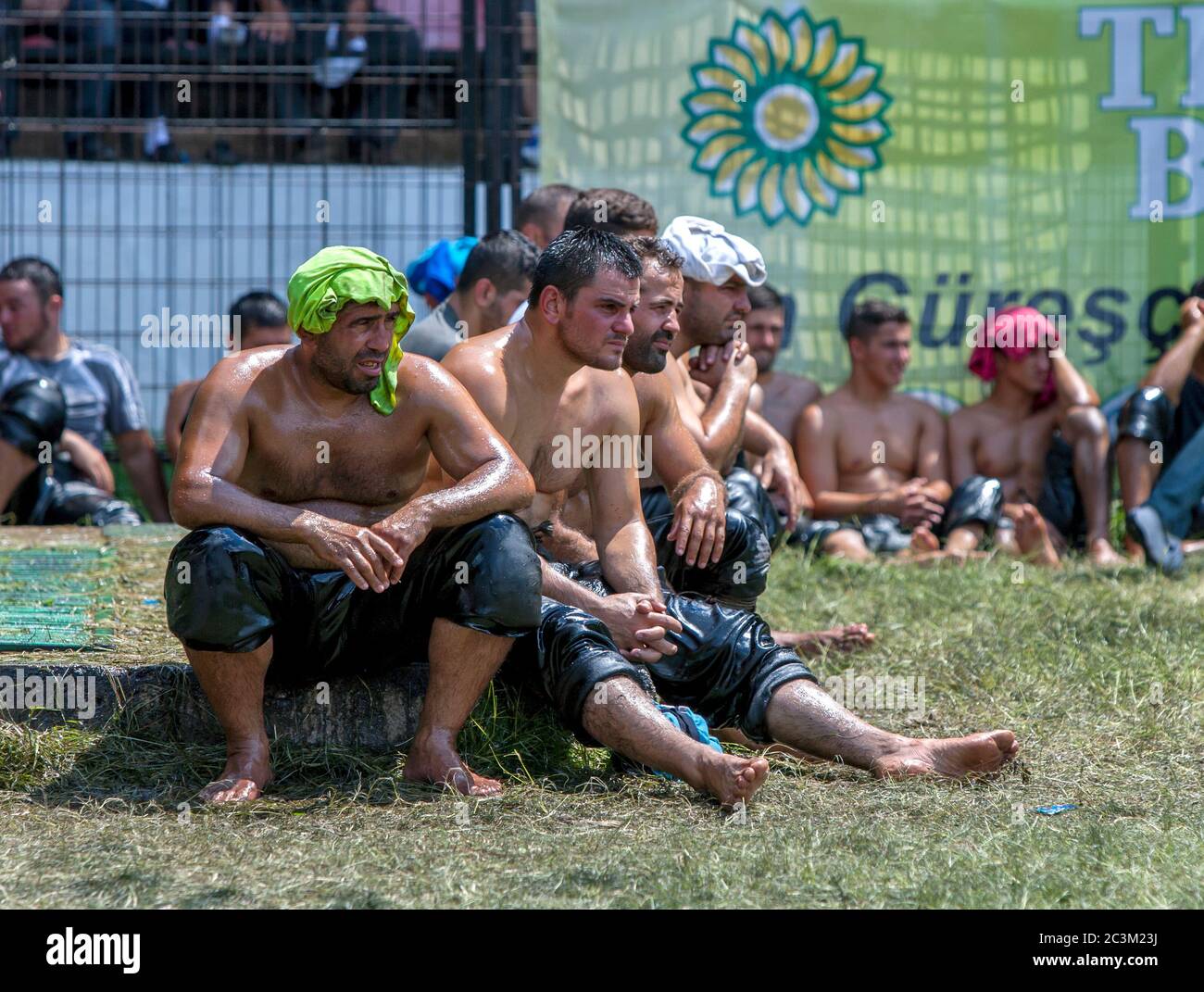 Exhausted Wrestlers Sit Inside The Arena At The Kirkpinar Turkish Oil Wrestling Festival At