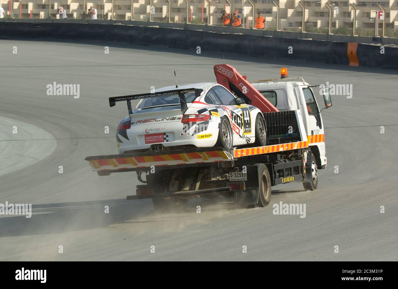 DUBAI JANUARY 13 Car 44, a Porsche 997 GT3 Cup, being transported