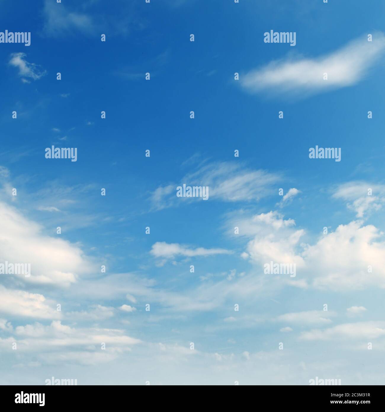 light cumulus clouds in the blue sky Stock Photo - Alamy