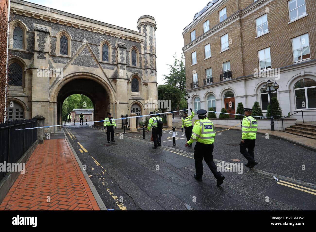 Police at the Abbey gateway of Forbury Gardens in Reading town centre following a multiple stabbing attack in the gardens which took place at around 7pm on Saturday leaving three people dead and another three seriously injured. Stock Photo