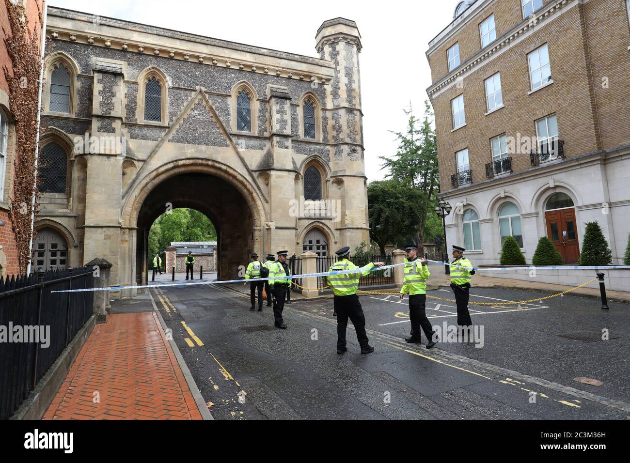 Police at the Abbey gateway of Forbury Gardens in Reading town centre following a multiple stabbing attack in the gardens which took place at around 7pm on Saturday leaving three people dead and another three seriously injured. Stock Photo