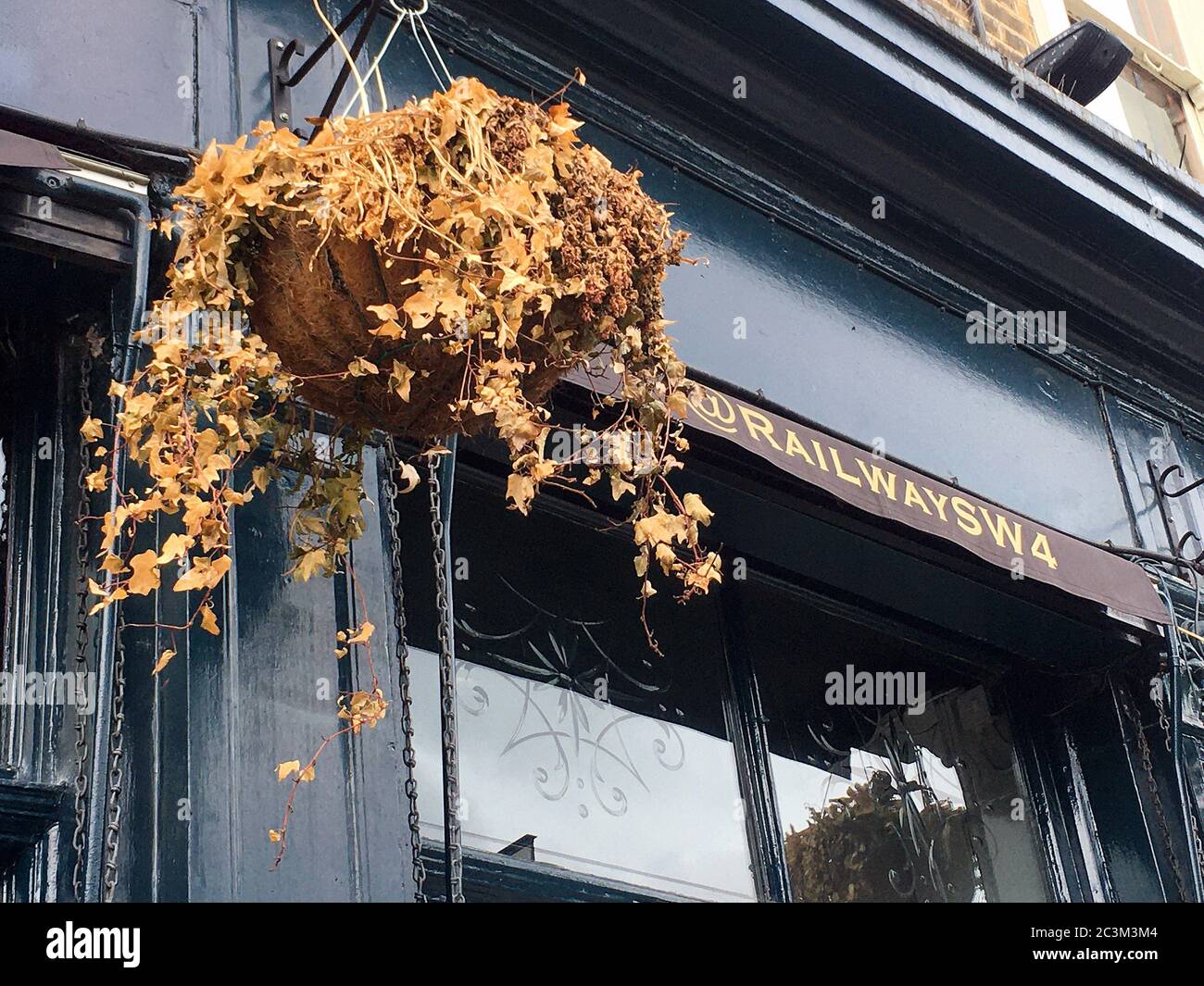 Hanging Basket with dead flowers Stock Photo Alamy