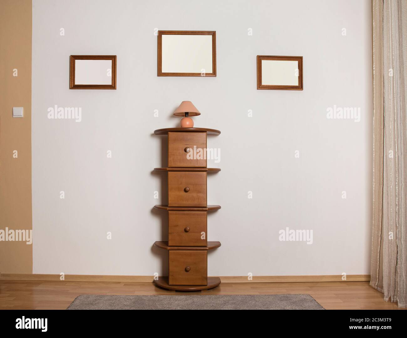 Empty Commode Empty wooden frames on a wall with a commode Stock Photo - Alamy