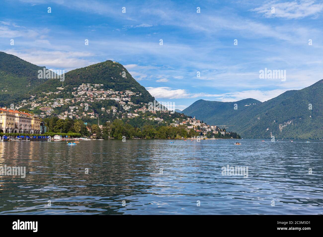 Beautiful  panorama view of Lugano Lake, cityscape of Lugano, mountain Monte Bre and Swiss Alps on a sunny summer day with blue sky cloud, Canton of T Stock Photo