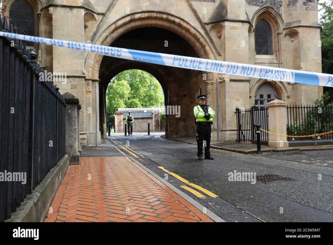 Police at the Abbey gateway of Forbury Gardens in Reading town centre following a multiple stabbing attack in the gardens which took place at around 7pm on Saturday leaving three people dead and another three seriously injured. Stock Photo