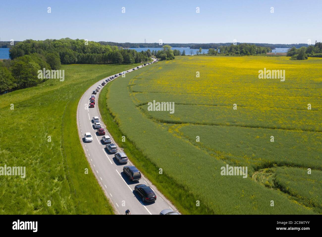 Cars queue for the ferry over to Ljusterö. Stock Photo