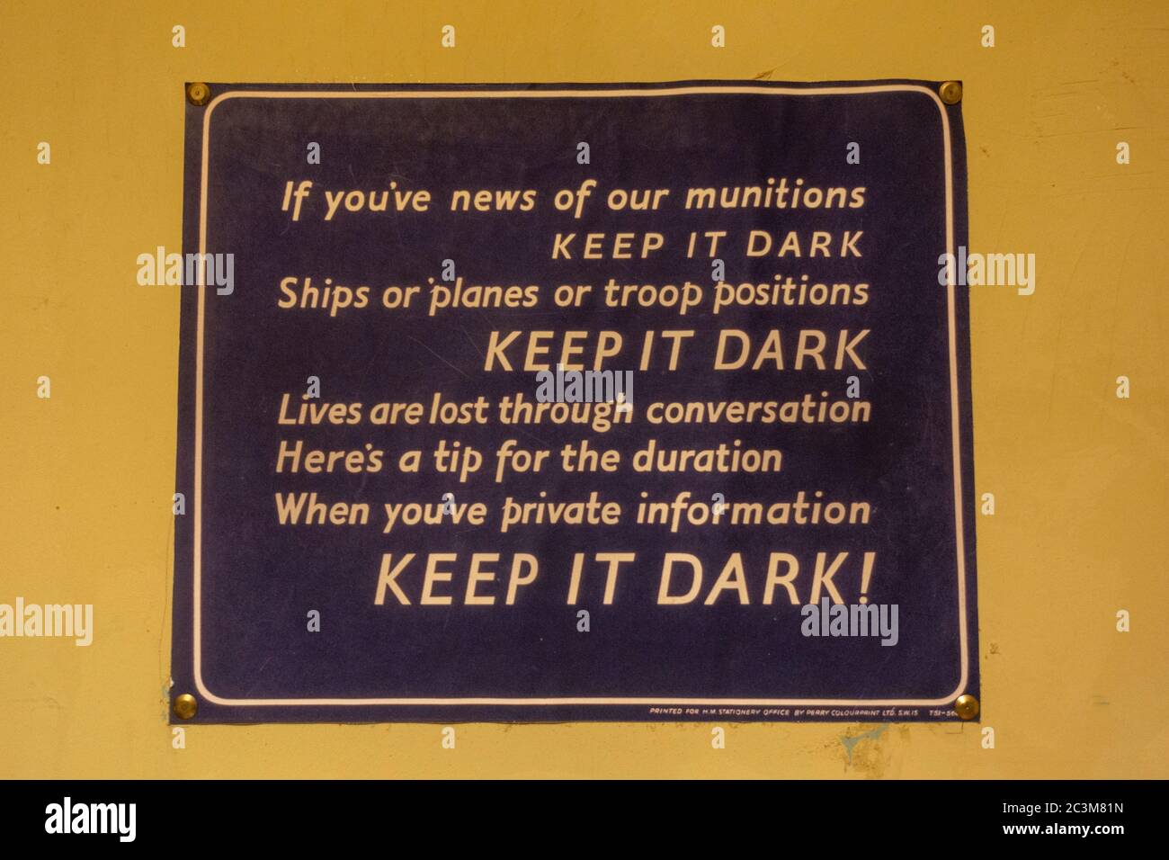 WWII poster warning workers about the dangers of careless talk, 'Keep It Dark' on display in Bletchley Park, Bletchley. Buckinghamshire, UK. Stock Photo