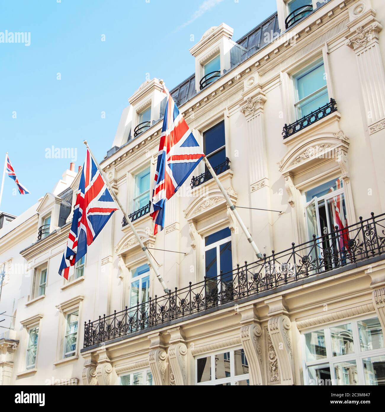 British flags flying on the balcony of a historic building in central London Stock Photo Alamy