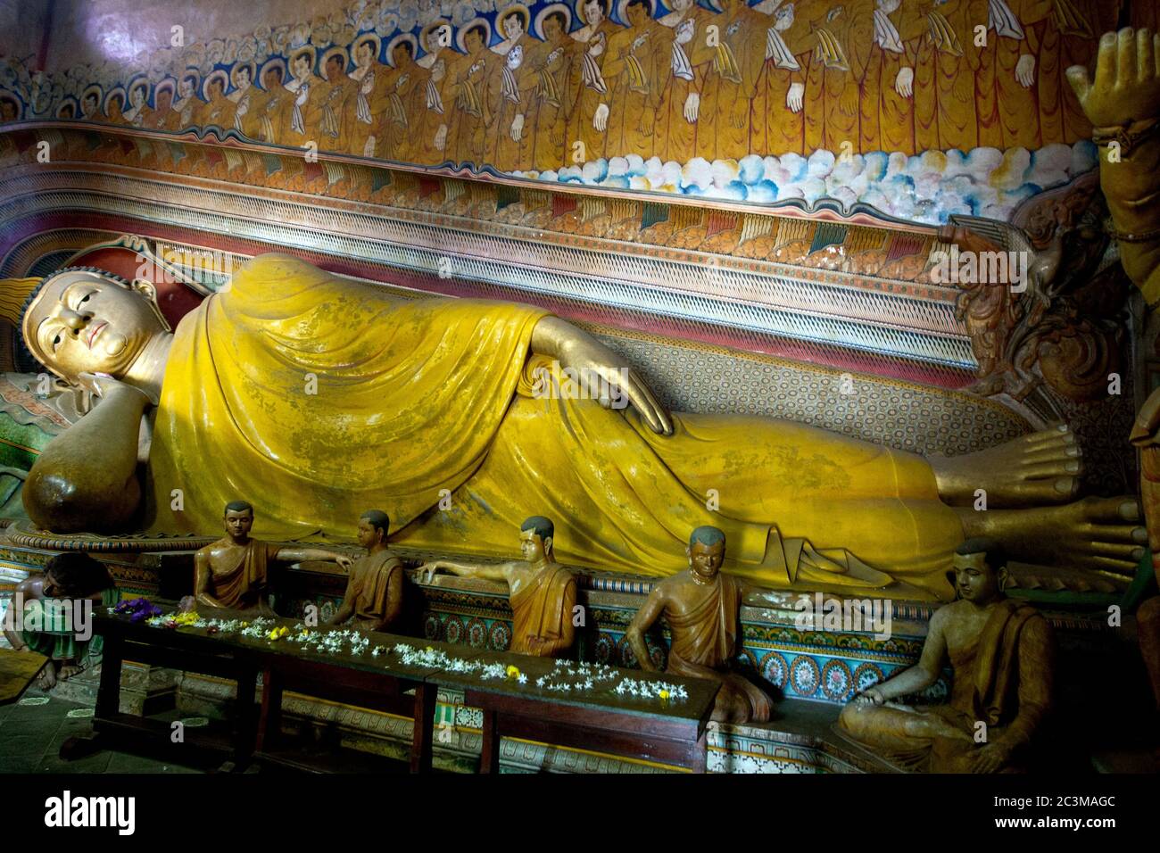 The reclining Buddha statue in the Shrine Room at Wewurukannala Vihara at Dickwella in Sri Lanka. Stock Photo