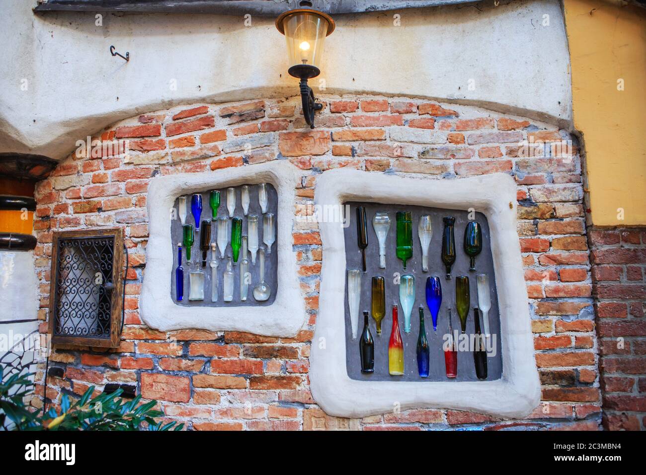 Decorative elements from multi-colored glass bottles on the walls in Museum  Hundertwasser in Kunst Haus Wien in Vienna, Austria. Ecological commitment  Stock Photo - Alamy