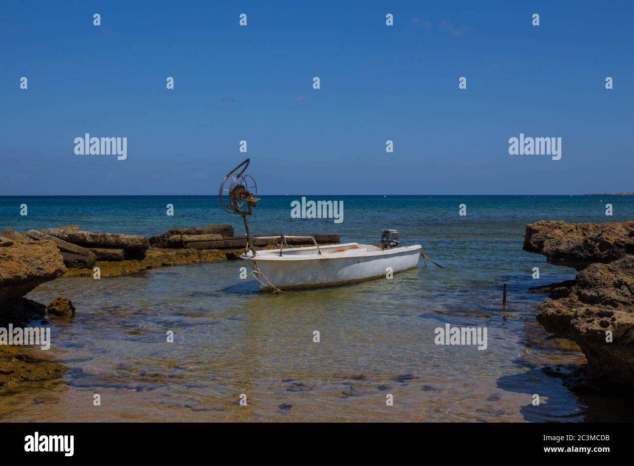 Small sighing boat on the beach of Mediterranean sea near Protaras village in Cyprus Stock Photo