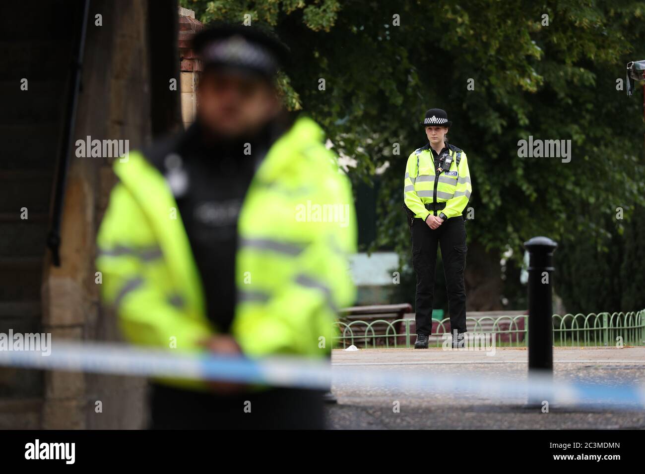 Police at the Abbey gateway of Forbury Gardens in Reading town centre following a multiple stabbing attack in the gardens which took place at around 7pm on Saturday leaving three people dead and another three seriously injured. Stock Photo