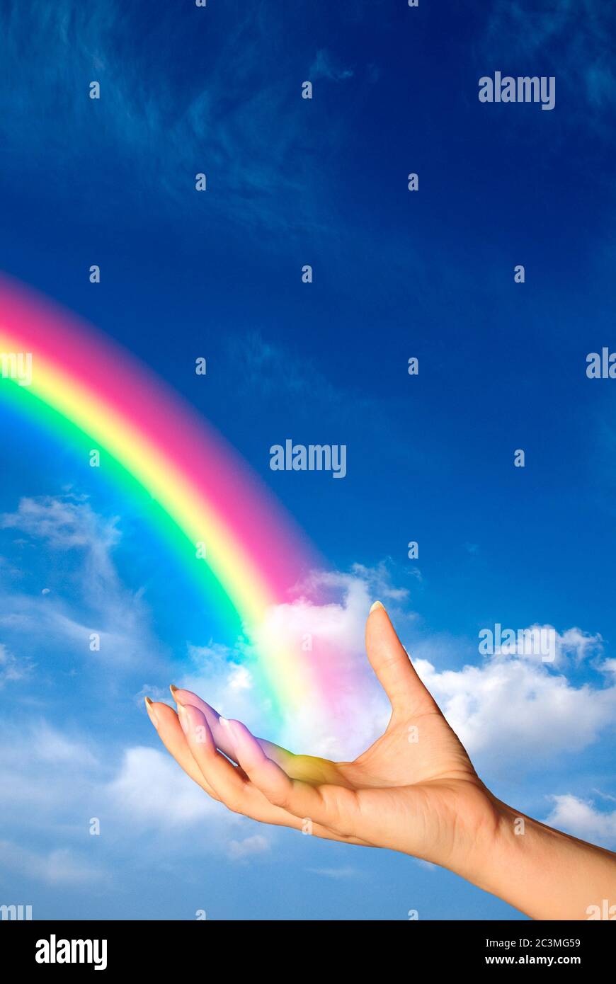 hand holding a rainbow, hope and bright, optimistic future concept Stock Photo