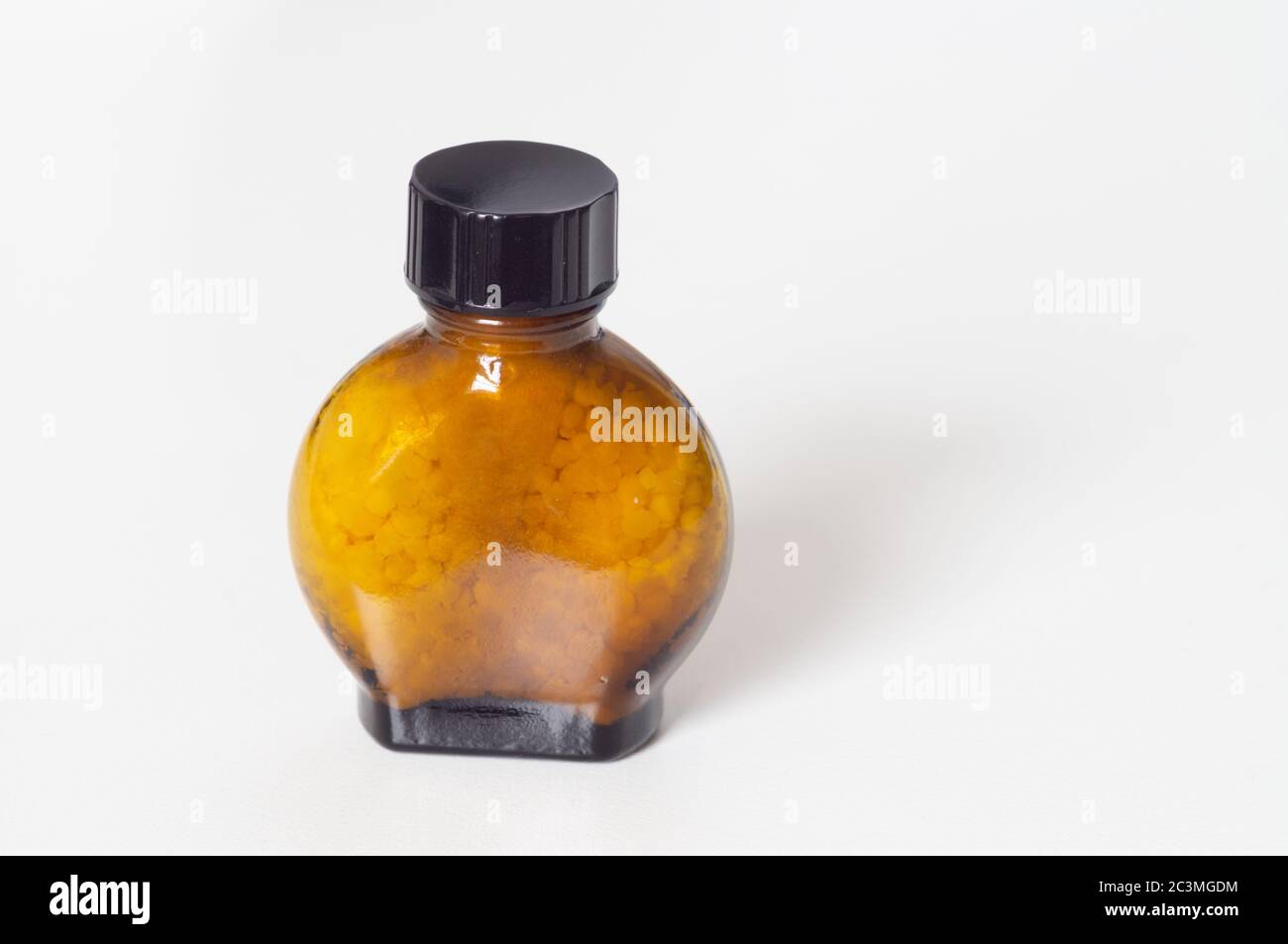 Smelling salts ammonia inhalants or aromatic spirits of ammonia for the relief of light headedness or fainting - in a plain jar or flask Stock Photo