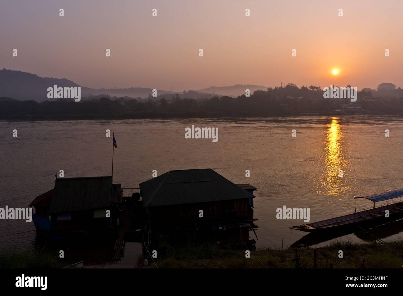 Boat at Pier While Sunrise at Mekong River, Chiang Khong, Thailand, Asia Stock Photo