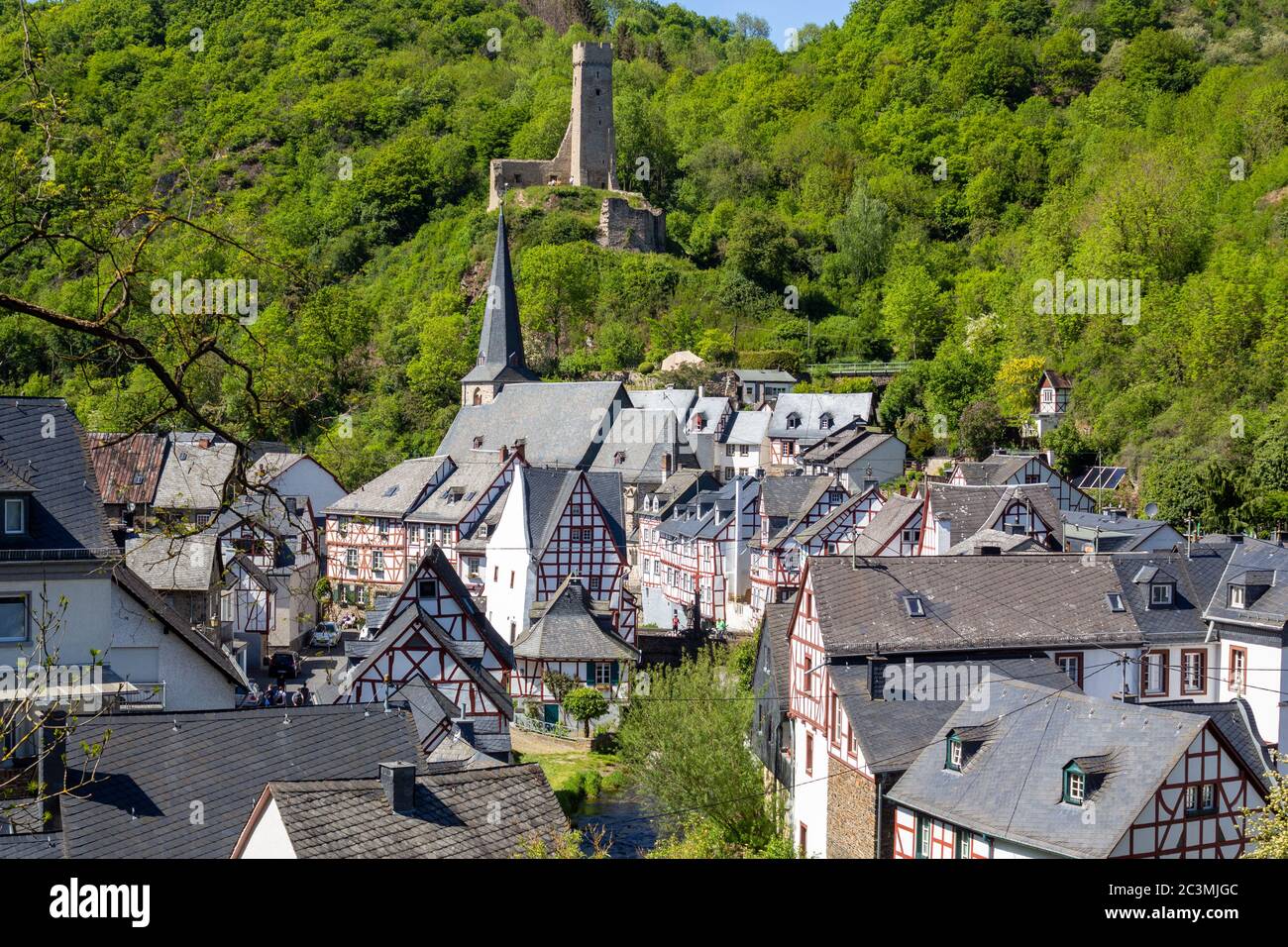 Scenic view on half-timbered houses and ruin Loewenburg in the village Monreal, Eifel, Germany Stock Photo