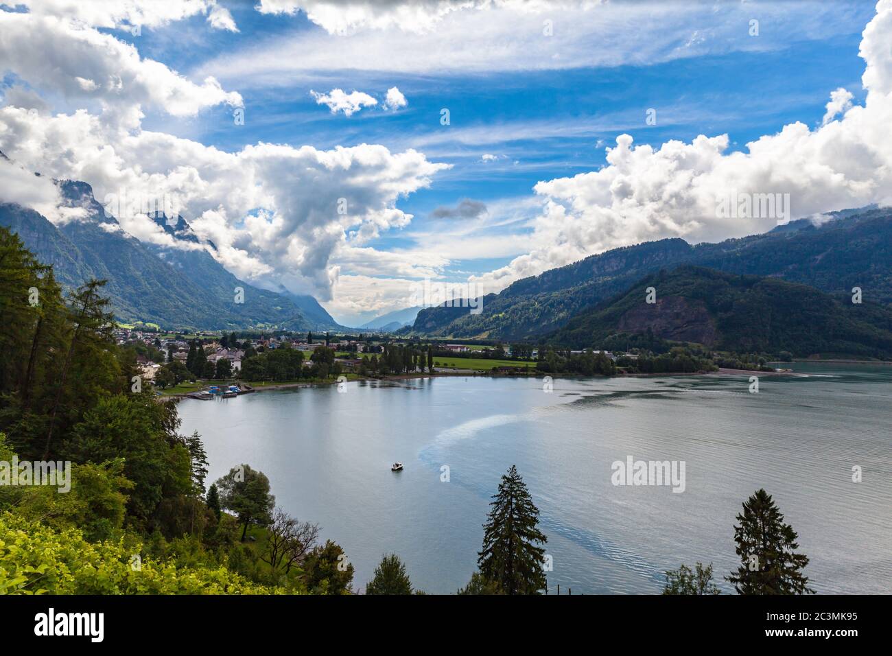 Aerial view of  Walensee lake and small town Walenstadt, on a cloudy summer day, Canton of St. Gallen, Switzerland. Stock Photo
