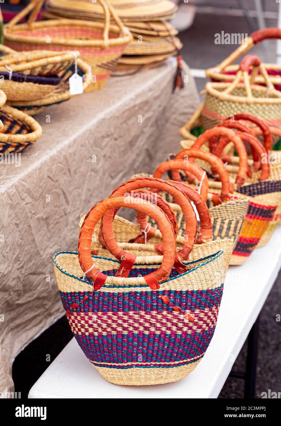 Beautiful handmade West African tote bags with a leather handle at an outdoor market Stock Photo