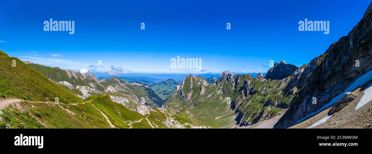 Panorama view of Alpstein Massif from Rotsteinpass, toward Wasserauen valley on the hiking trail to Santis (Saentis), Canton of St. Gallen, Appenzell, Stock Photo