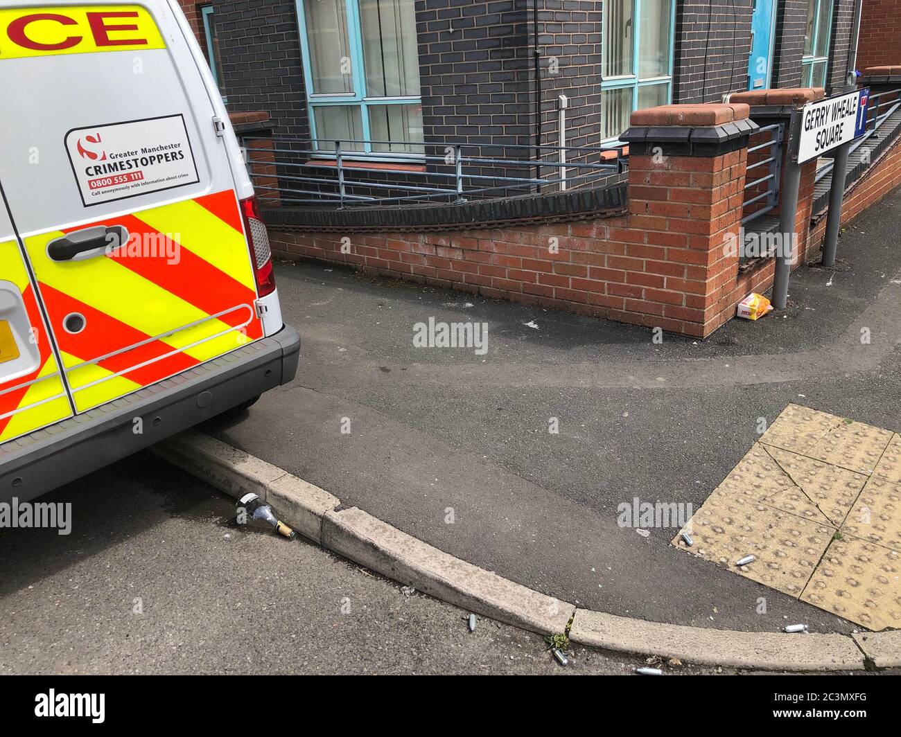 a-broken-bottle-and-gas-canisters-near-to-the-scene-of-a-fatal-shooting