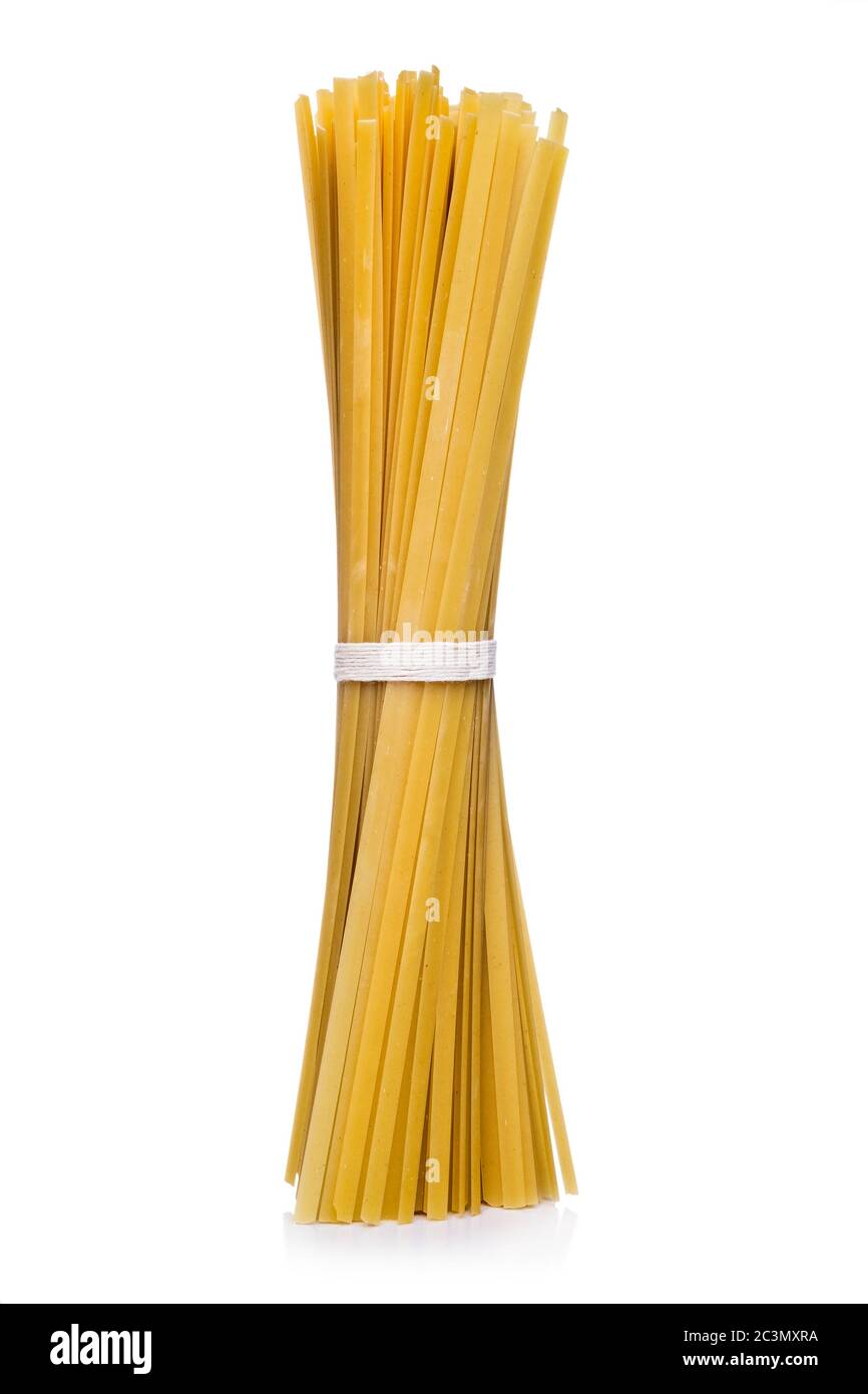 Bundle of dried Italian spaghetti pasta tied in the centre standing