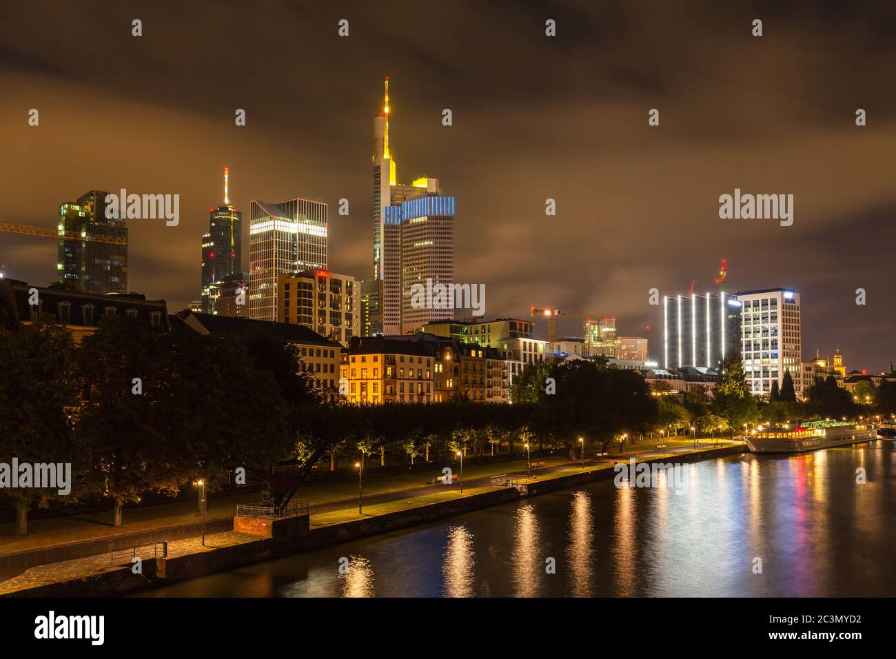 Night view of the skyline of Frankfurt am Main from the Holbeinsteg bridge with the skyscrapers and modern buildings, Hesse, Germany Stock Photo