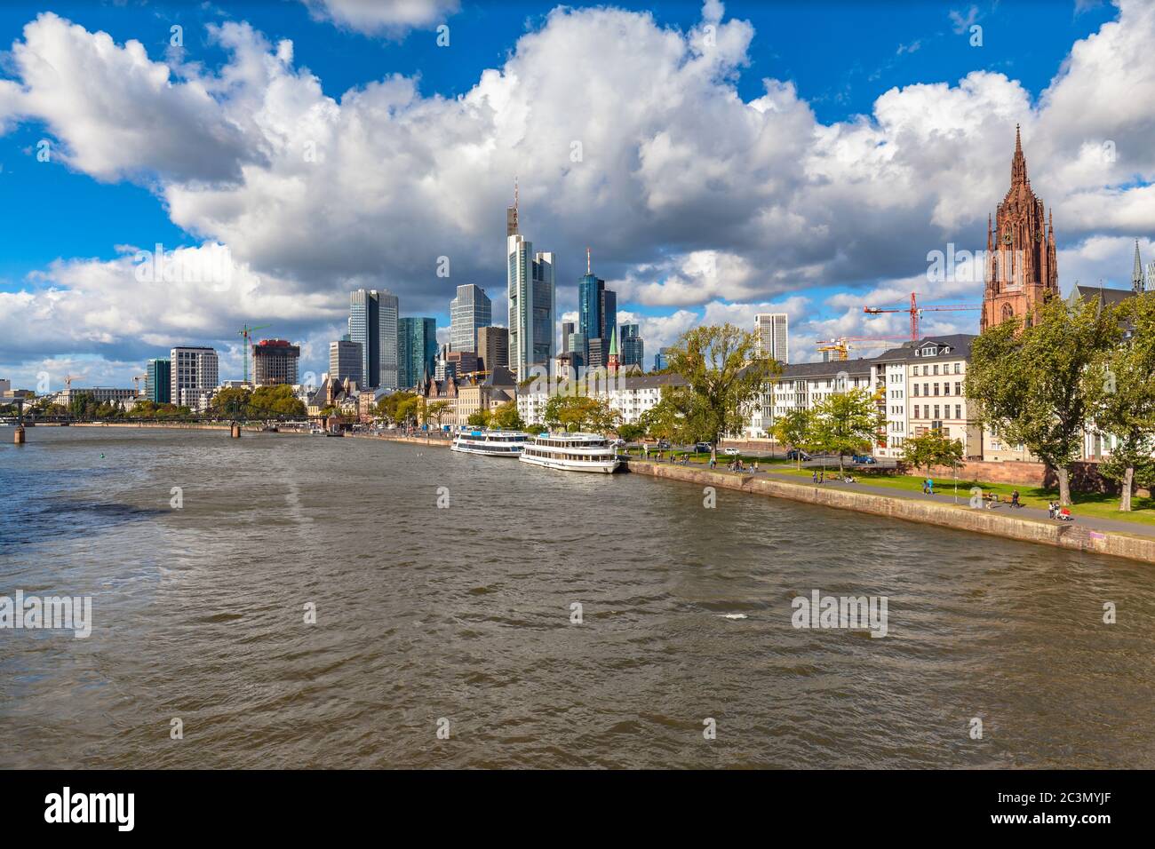 Stunning of the skyline of Frankfurt am Main with skyscrapers and mordern buildings on the river bank of Main, with magnificent cloudscape, Hesse, Ger Stock Photo